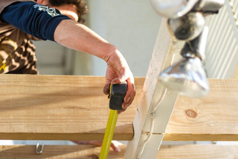 Building and plastering services image: construction workers next to a frame and an expert plasterer. Local building contractors and professional plastering experts.